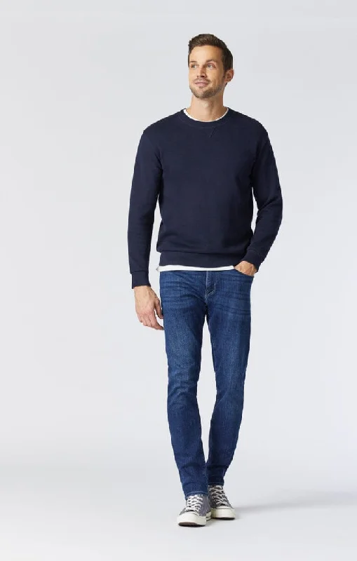 Men's Distressed Jeans with Patches for a Retro and DIY - Inspired AppearanceMATT RELAXED STRAIGHT LEG IN DEEP BRUSHED WILLIAMSBURG Men's Distressed Jeans with Patches for a Retro and DIY - Inspired AppearanceMATT RELAXED STRAIGHT LEG IN DEEP BRUSHED WILLIAMSBURG
